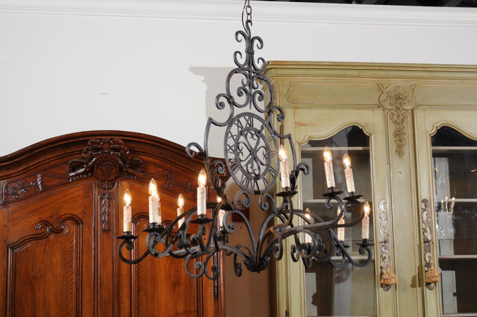 French 12-Light Wrought-Iron Chandelier with Clock Motif and Scrolling Armature For Sale 4