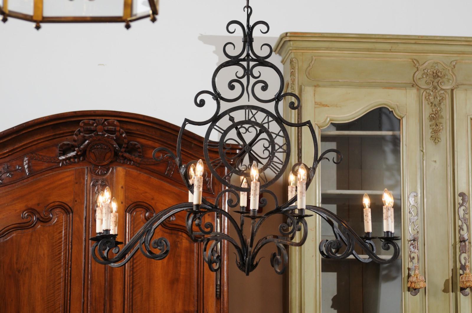 20th Century French 12-Light Wrought-Iron Chandelier with Clock Motif and Scrolling Armature