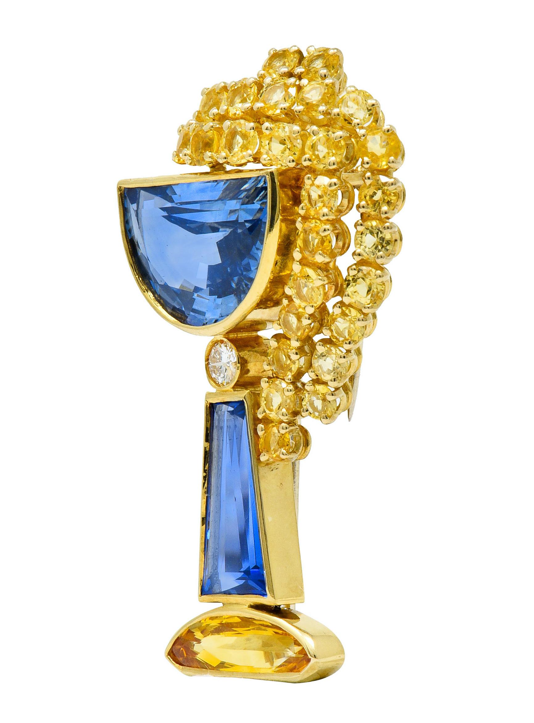 Brooch is comprised of three bezel set and fancily cut sapphire as a stylized goblet form, weighing in total approximately 13.00 carats

Overflowing with a cascade of round cut sapphire, each individually set in its own basket, weighing