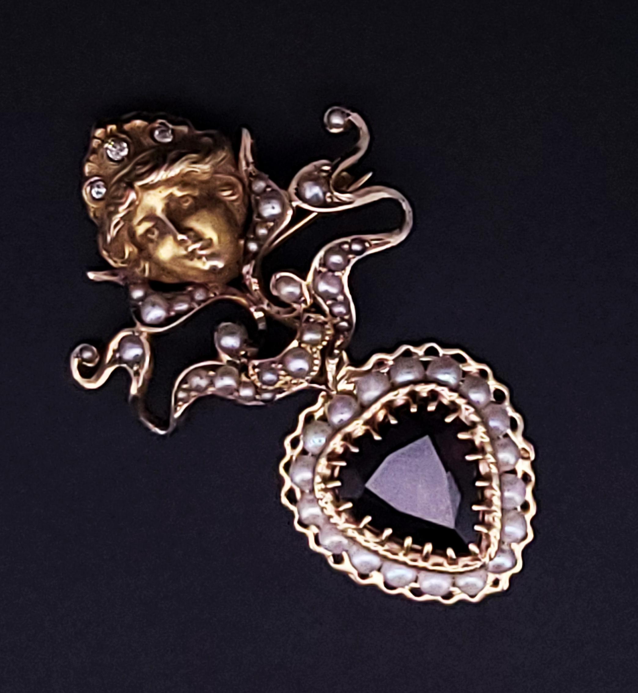 BROCHE FRANCÉS DE ORO DE 14K GRANATE CON DIAMANTES

-Metal: Oro de 14 quilates
-Dimensión del broche: 44,1mm x 27mm
-Granate: 5ct, 11,5mm x 10,5mm
-Diamantes: 0,06 ct, Antiguos Mineros
-Peso: 7 gr