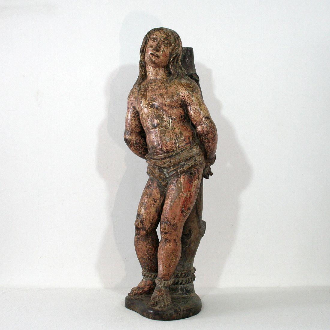 Beautiful carved statue of Saint Sebastian with traces of its original color, France, circa 1550-1650. Weathered, small losses.