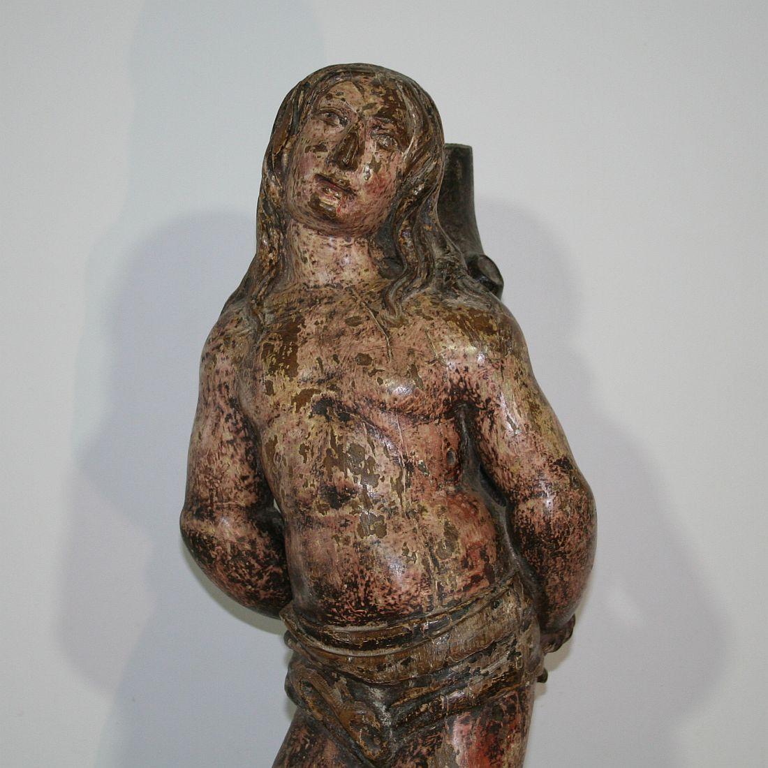 French 16th-17th Century Painted Wooden Statue of Saint Sebastian In Good Condition In Buisson, FR