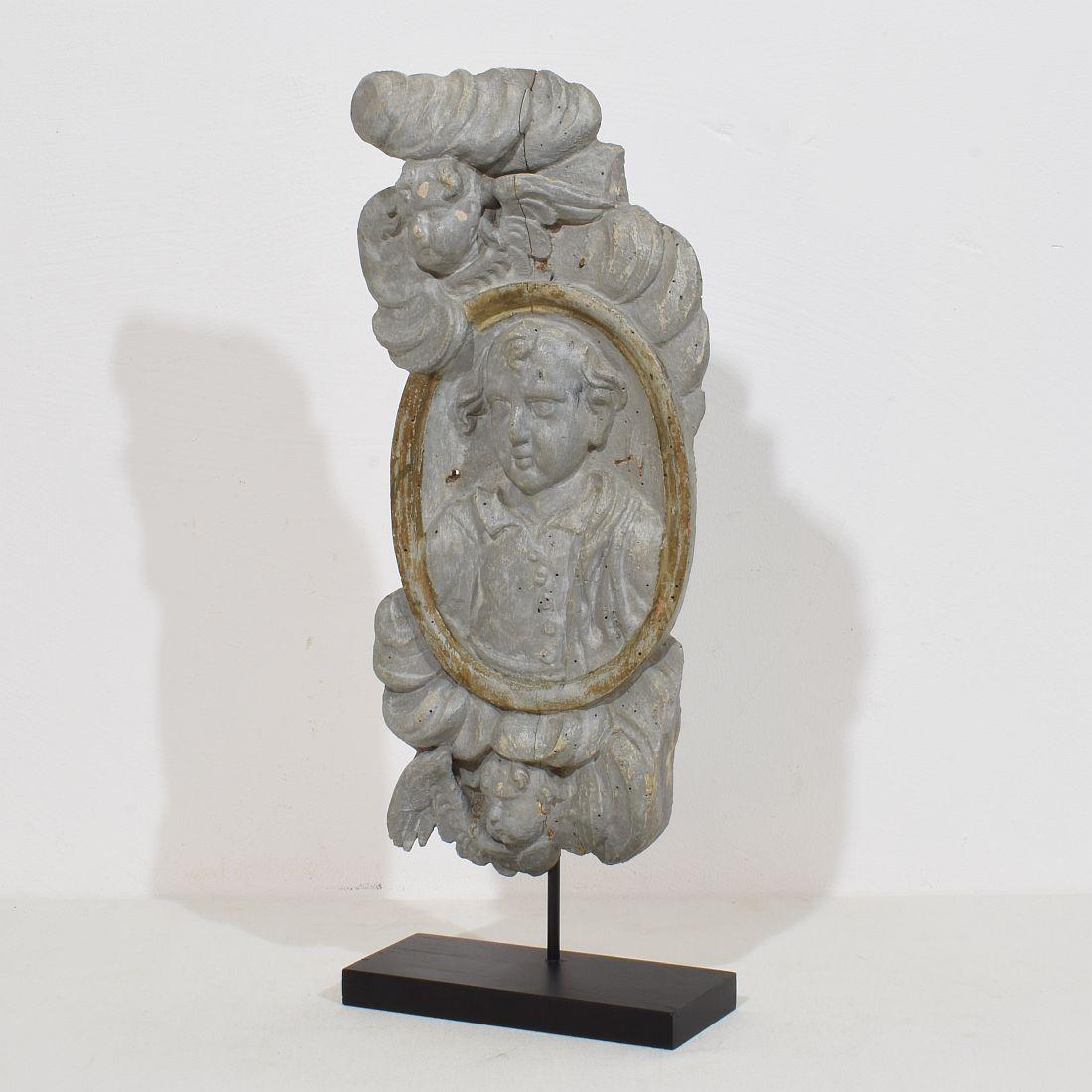 Unique panel depicting a saint figure and Angels. Wonderful layers of its original color,
France, circa 1650-1750 . Weathered, small losses.
Treated against woodworm.
Measurements include the wooden stand
H:46,5cm  W:18cm D:8cm 