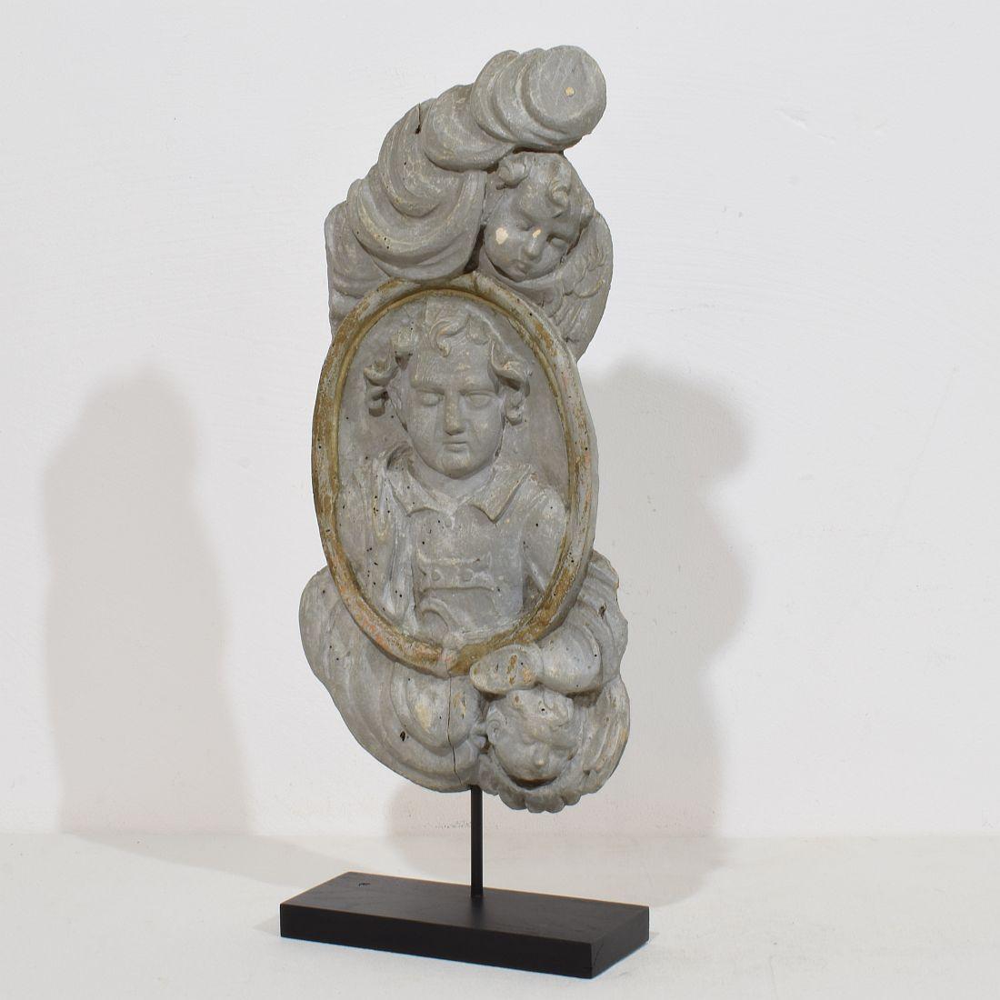 Unique panel depicting a Saint figure and Angels. Wonderful layers of its original color,
France, circa 1650-1750 . Weathered, small losses.
Treated against woodworm.
Measurements include the wooden stand
H:46,5cm  W:20cm D:7,5cm 