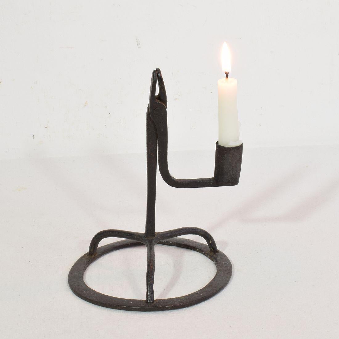 Very old and beautiful hand forged iron candleholder.
France, circa 1650-1750. Weathered.