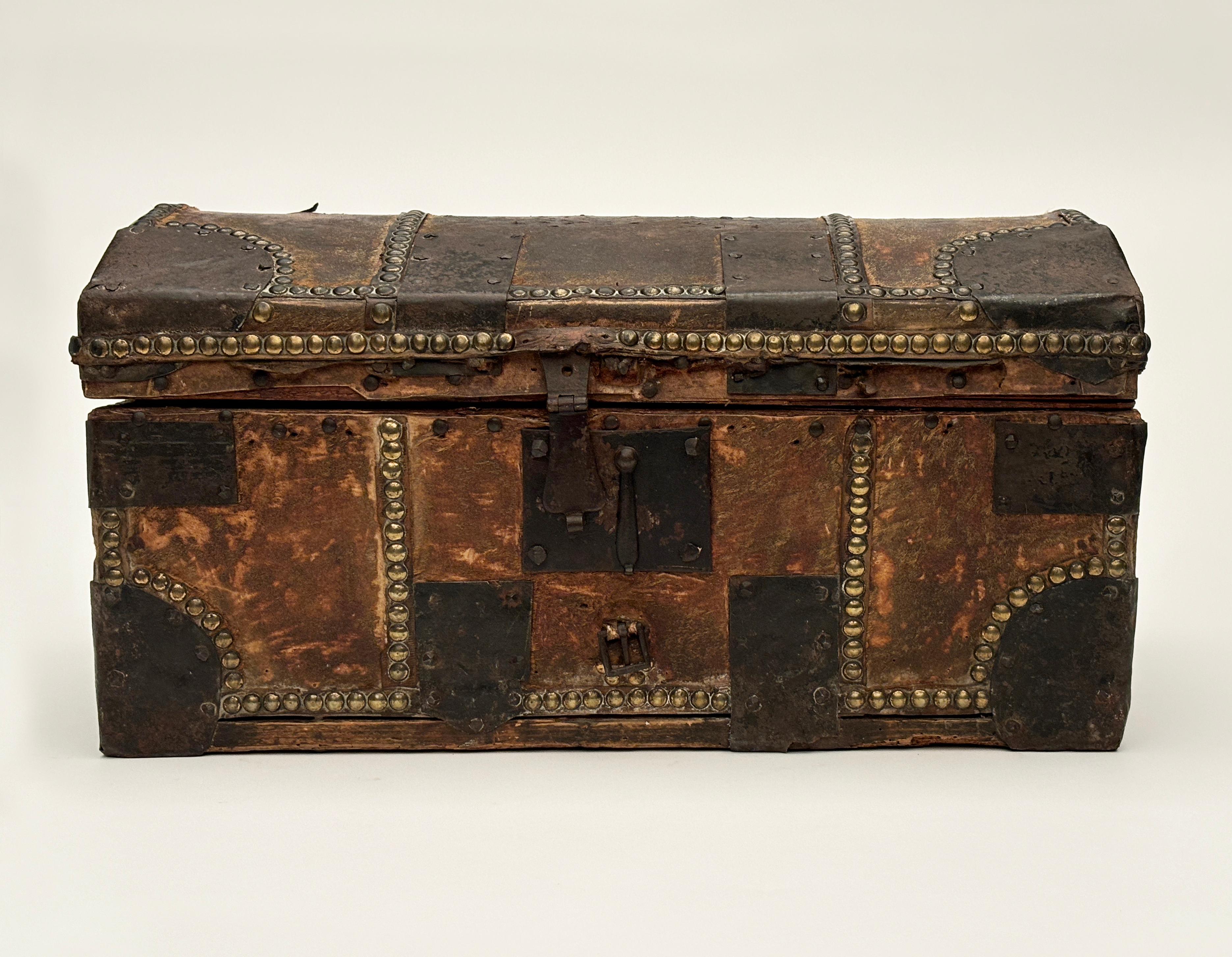 This whimsically charming 18th c. French messenger box is quite the unique find. The outside is covered in horse hide with a bit of the hair still intact. The leather is held in place with hand-forged iron straps and corners with hand-forged locks
