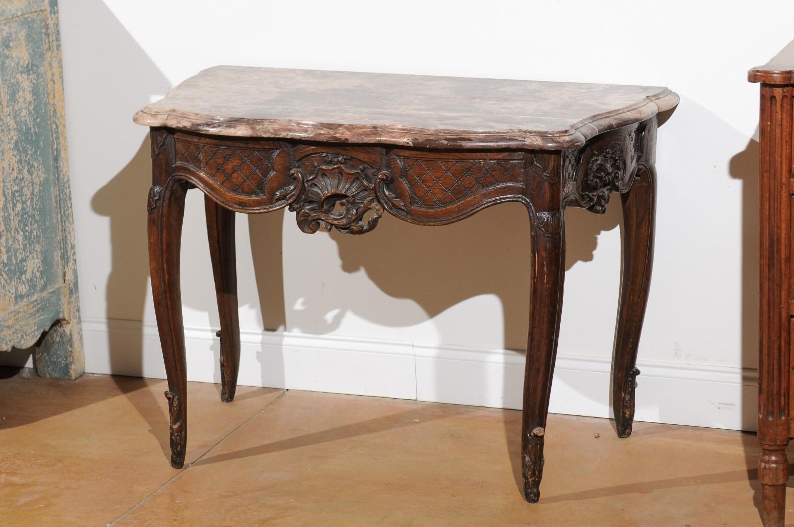 Carved French 1720s Régence Period Walnut Console Table with Original Marble Top For Sale
