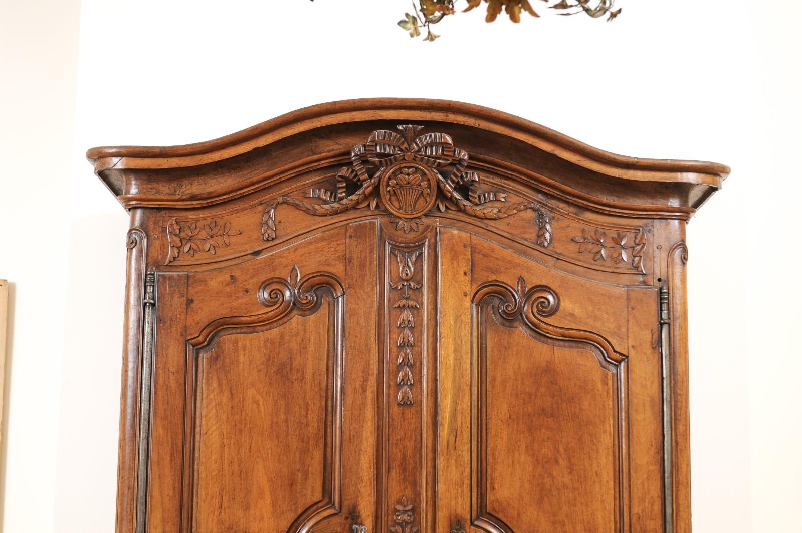 Hand-Carved French 1740s Louis XV Walnut Armoire from Nice, with Hand Carved Foliage Décor