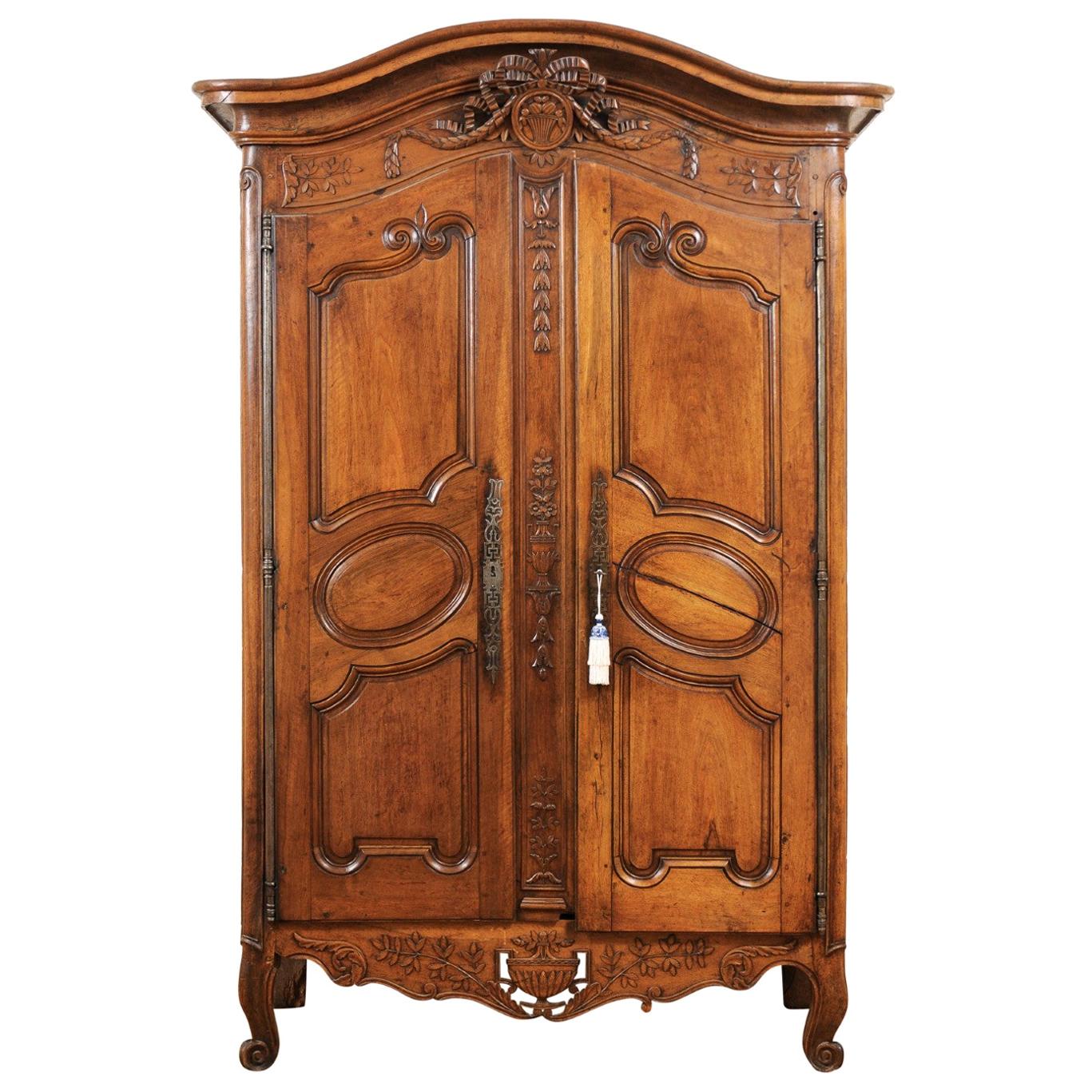 French 1740s Louis XV Walnut Armoire from Nice, with Hand Carved Foliage Décor