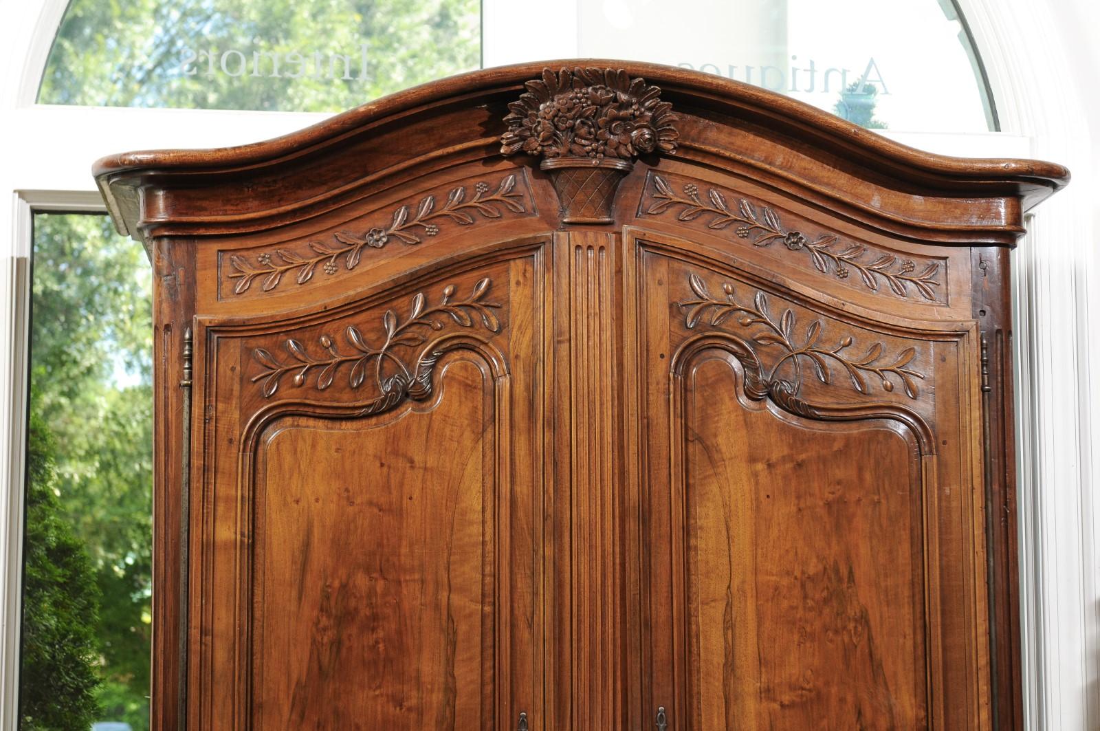 Hand-Carved French 1750s Louis XV Period Walnut Armoire from Provence with Foliage Motifs