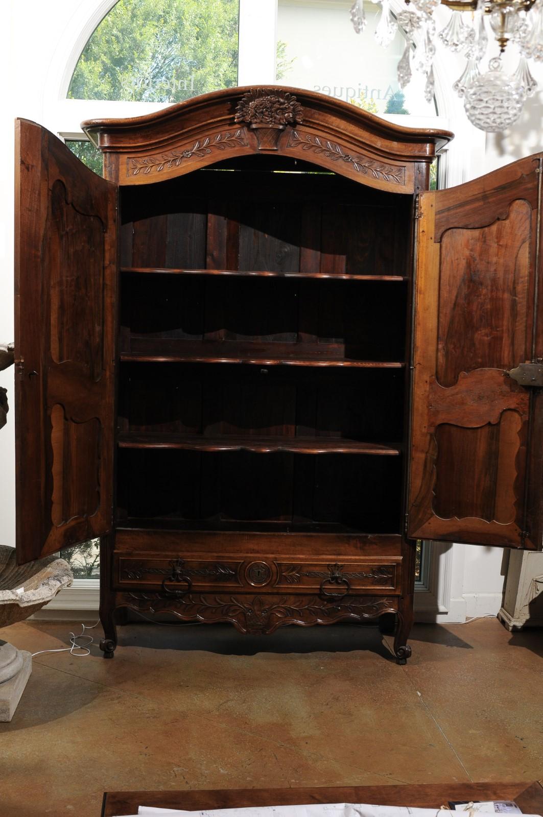 French 1750s Louis XV Period Walnut Armoire from Provence with Foliage Motifs In Good Condition In Atlanta, GA