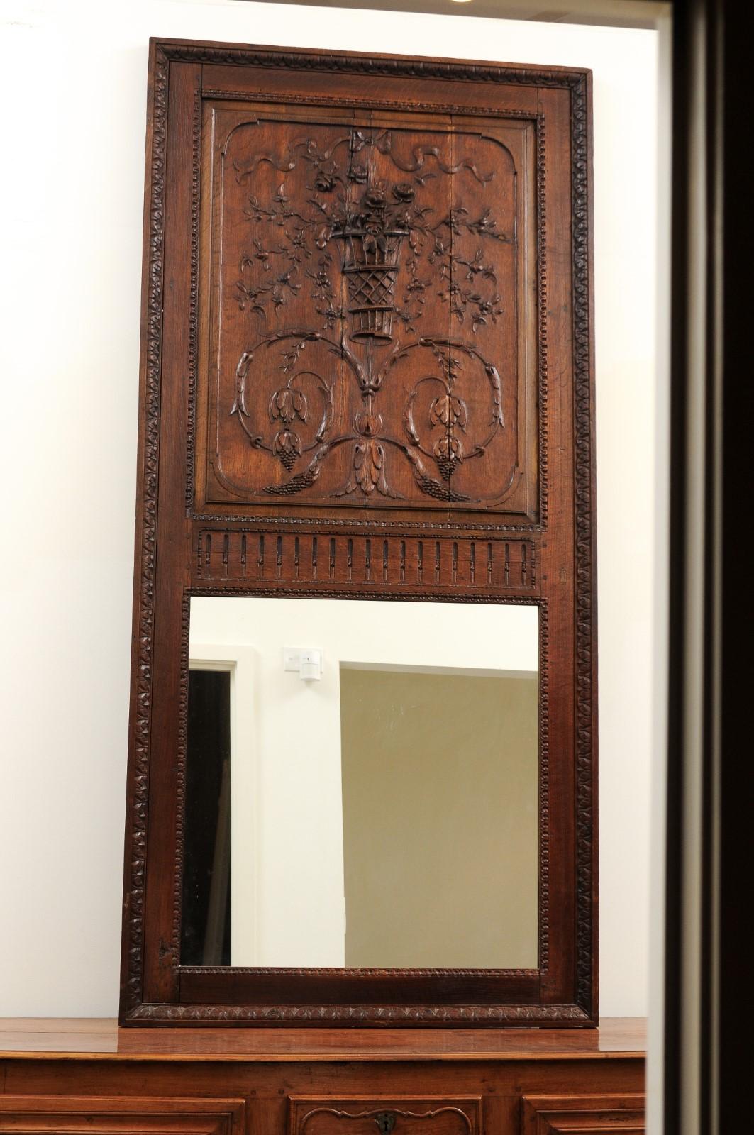 French 1750s Oak Trumeau Mirror with Large Carved Rinceaux and Floral Bouquet In Good Condition For Sale In Atlanta, GA