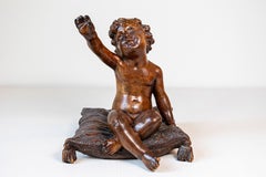 French 1780s Baroque Style Walnut Sculpture of a Putto Sitting on a Pillow