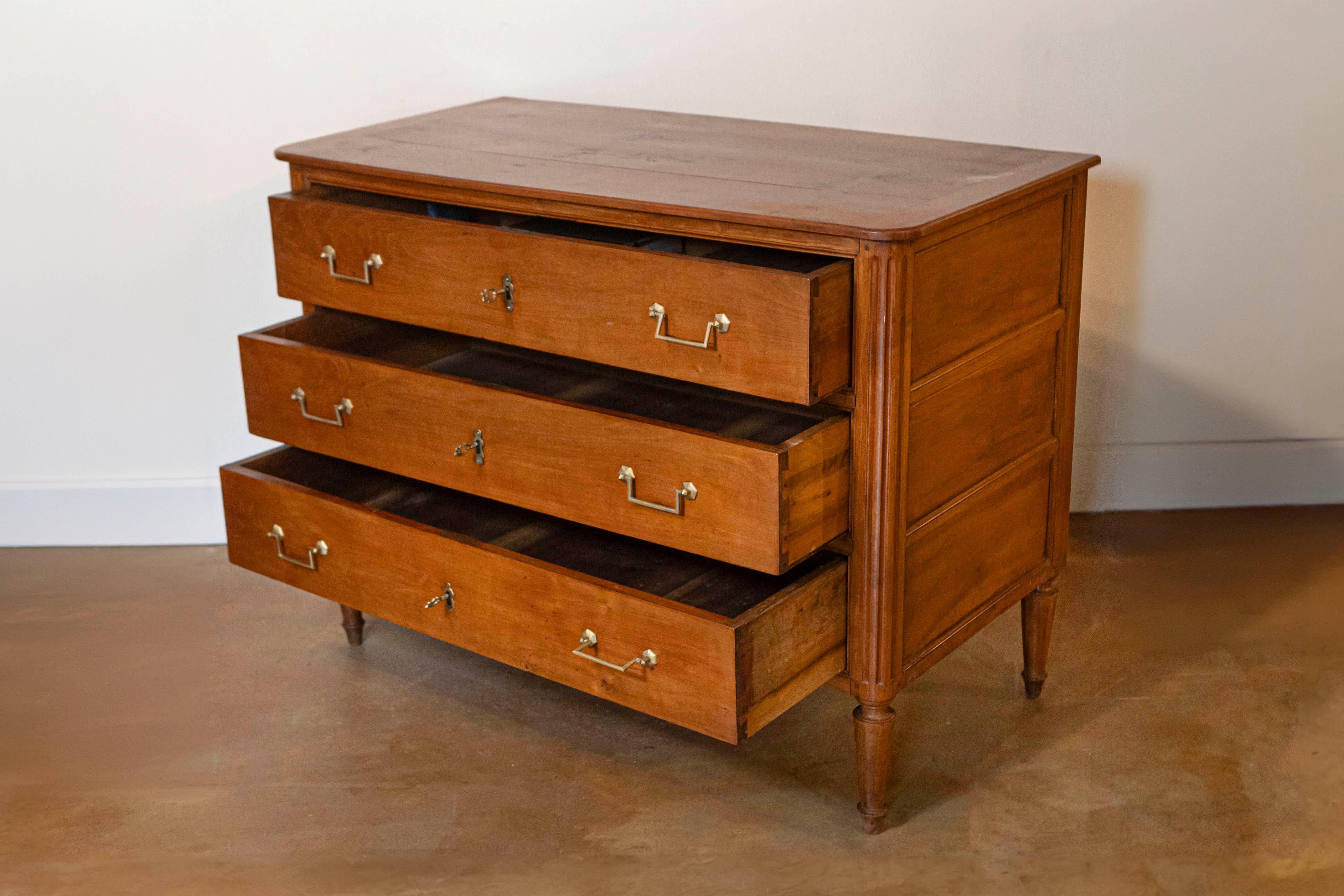 18th Century French 1790s Louis XVI Period Cherry Three-Drawer Commode with Fluted Side Posts For Sale