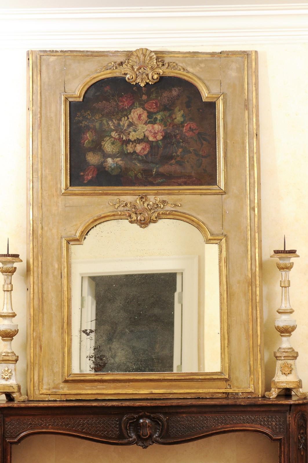 A French painted trumeau mirror from the late 18th century, with original oil on canvas floral painting. Created in France during the last decade of the 18th century, this trumeau mirror features an all original painted frame with gilded accents,