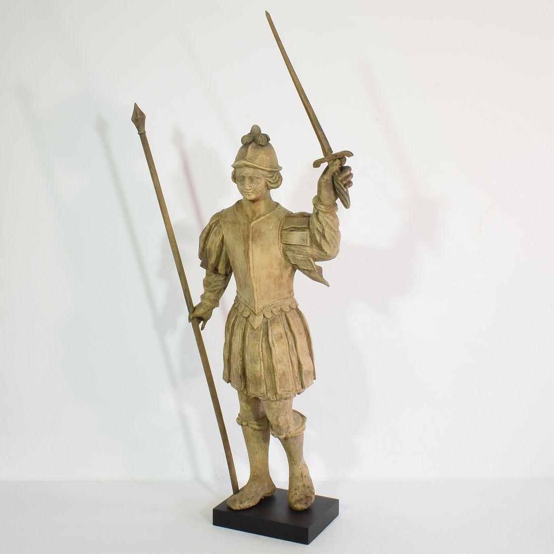 Wonderful baroque carved wooden armed figure. 
France, 17th-18th century. Weathered small losses and old repairs.
Measurement includes the sword and wooden base.