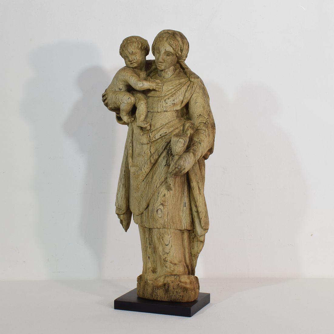 Beautiful weathered oak Madonna with child, France, circa 1650-1750. Weathered, losses.
Measurement includes the wooden base.