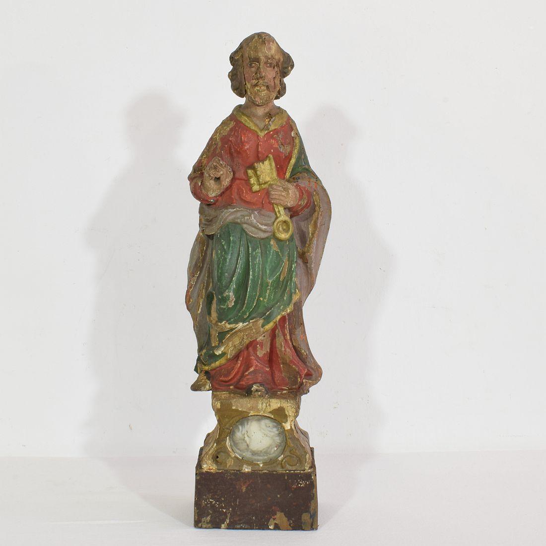 Unique hand carved saint peter with beautiful expression and small relique.
France, circa 1650-1750
Weathered and small losses.