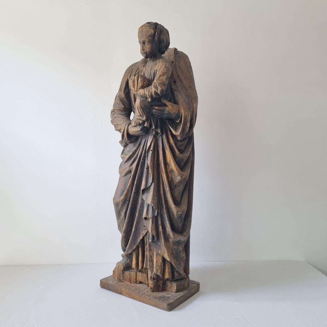 Beautiful weathered fragment of a carved wooden Madonna with child.
Despite of the fact this Madonna misses her head this statue has a wonderful and very strong expression.
France, circa 1650-1750. Weathered, losses and several repairs on the head