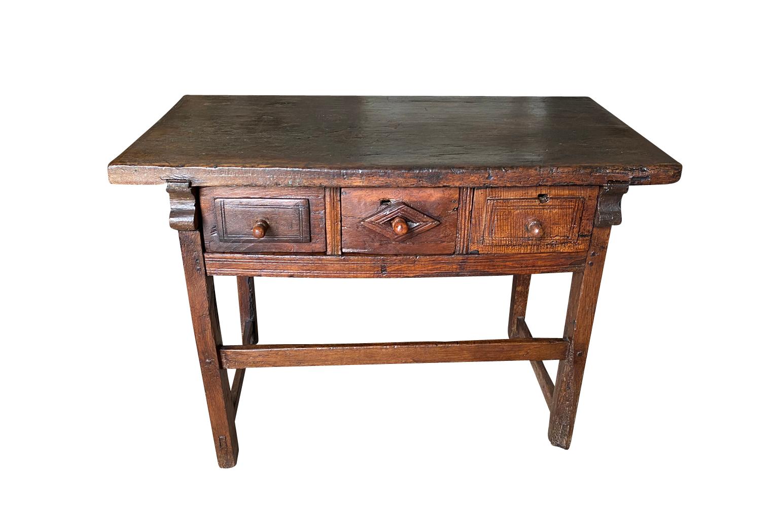 A very handsome 17th century Arte Populaire Side Table from the Ardeche region of France. Beautifully constructed from chestnut with a solid board top and 3 drawers. Sensational patina and graining.