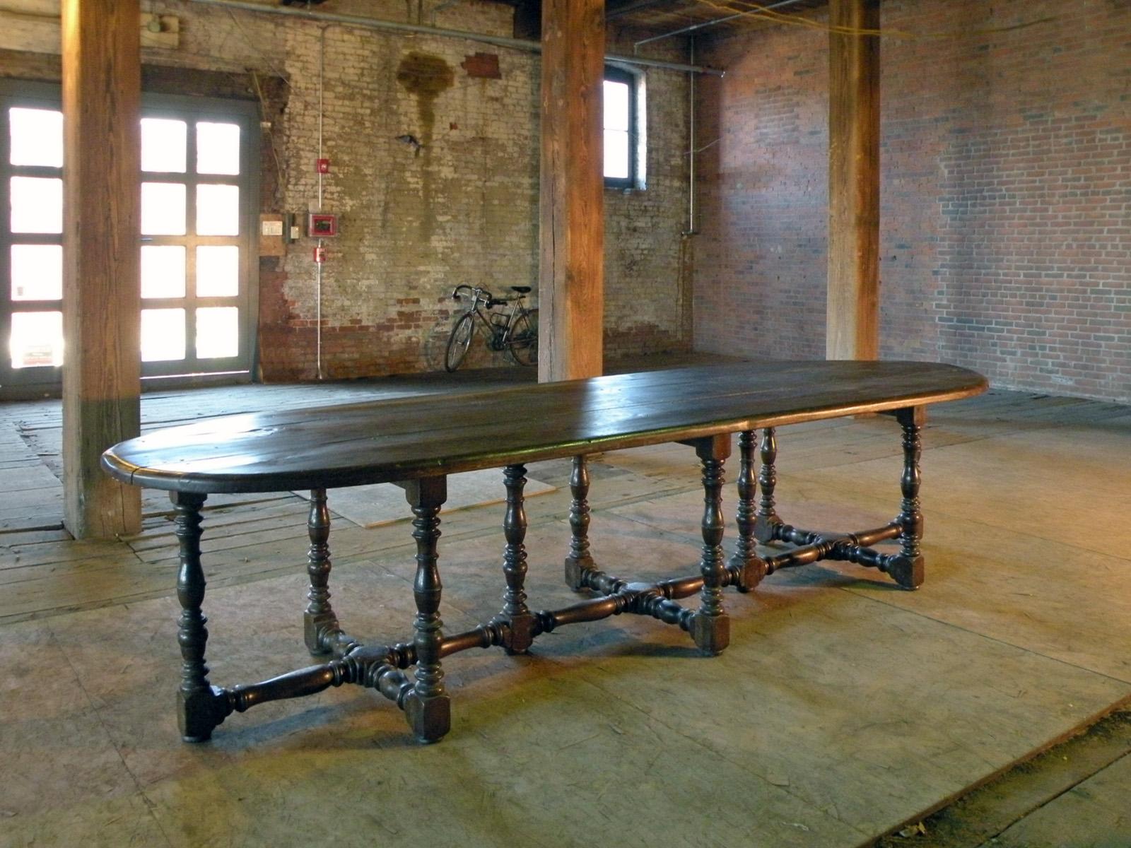 Exceptional, Large 17th Century Dining Table of unique and conceptual design.
The over 11 feet long, massive three-board top with rounded ends supported by ten turned legs joined by conforming turned and beautifully worn down cross-stretchers.
Deep