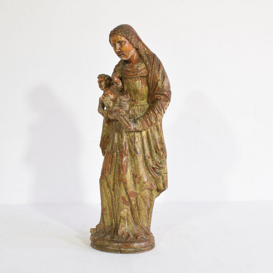 Beautiful hand carved wooden Madonna with child with beautiful details and traces of old color,
France, circa 1650-1700. Weathered and small losses.
More photo's available on request.
   