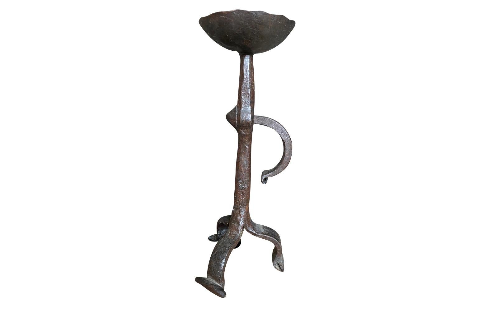 A very beautiful 17th century Bougeoire - Candlestick from the South of France.  Beautifully crafted from hand forged iron.  Terrific patina.  A perfect table top accessory.  