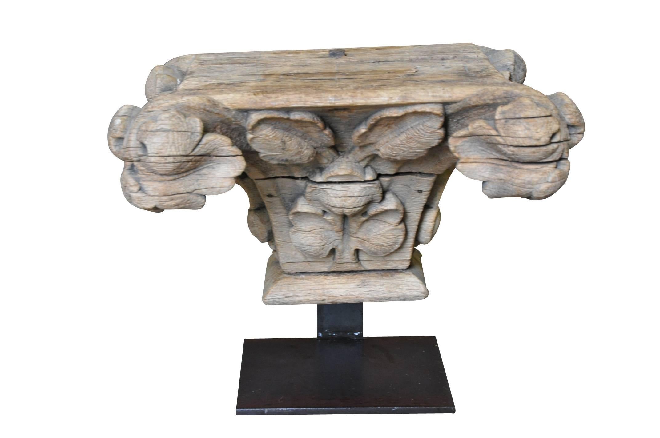 A very lovely 17th century Capital Fragment from the Provence region is France. Beautifully carved from wood with an incredible patina resulting from centuries of being exposed to the elements. The capital fragment is now mounted to a handsome iron