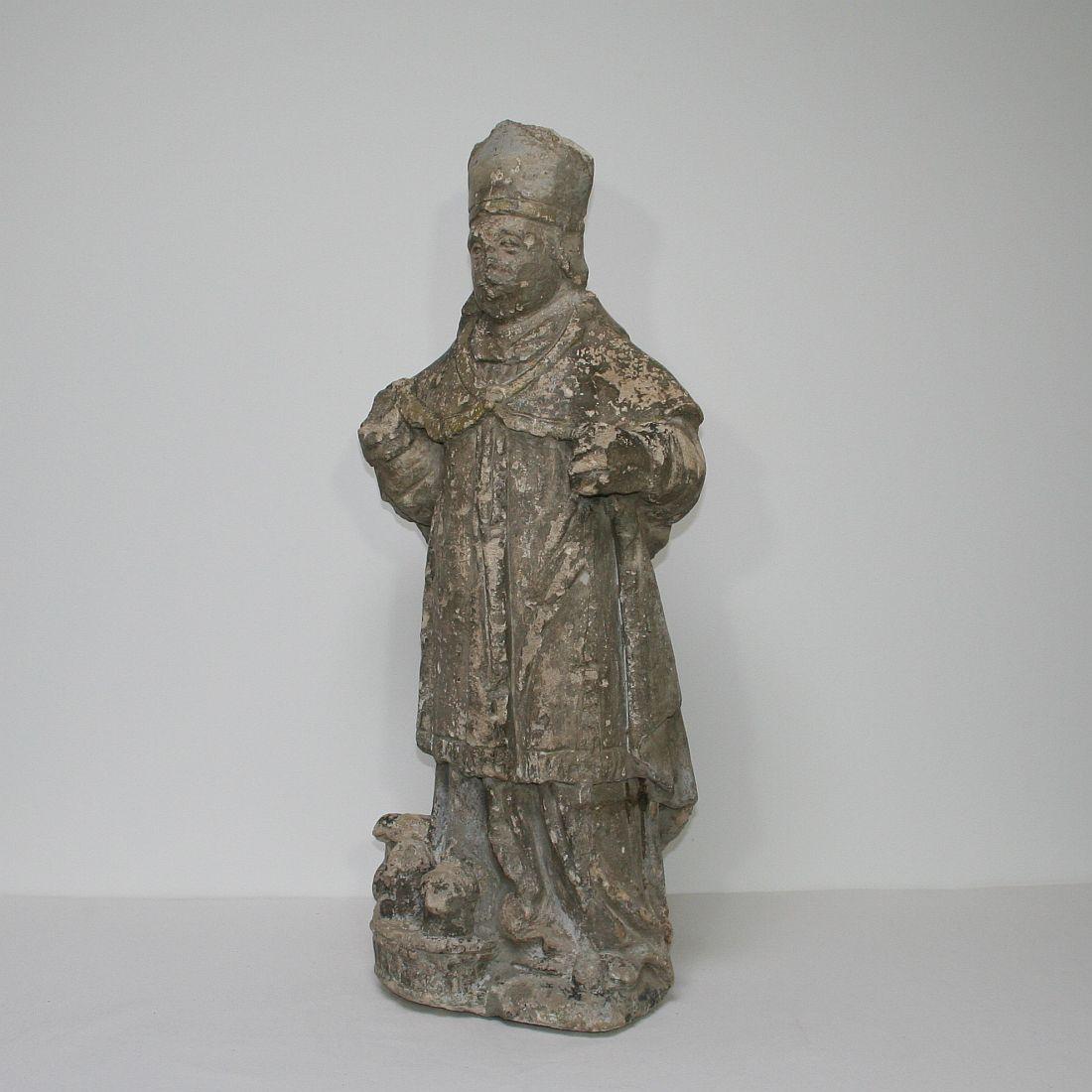 Beautiful stone statue of Saint Nicholas, France, 17th century. Weathered, losses and old repairs.