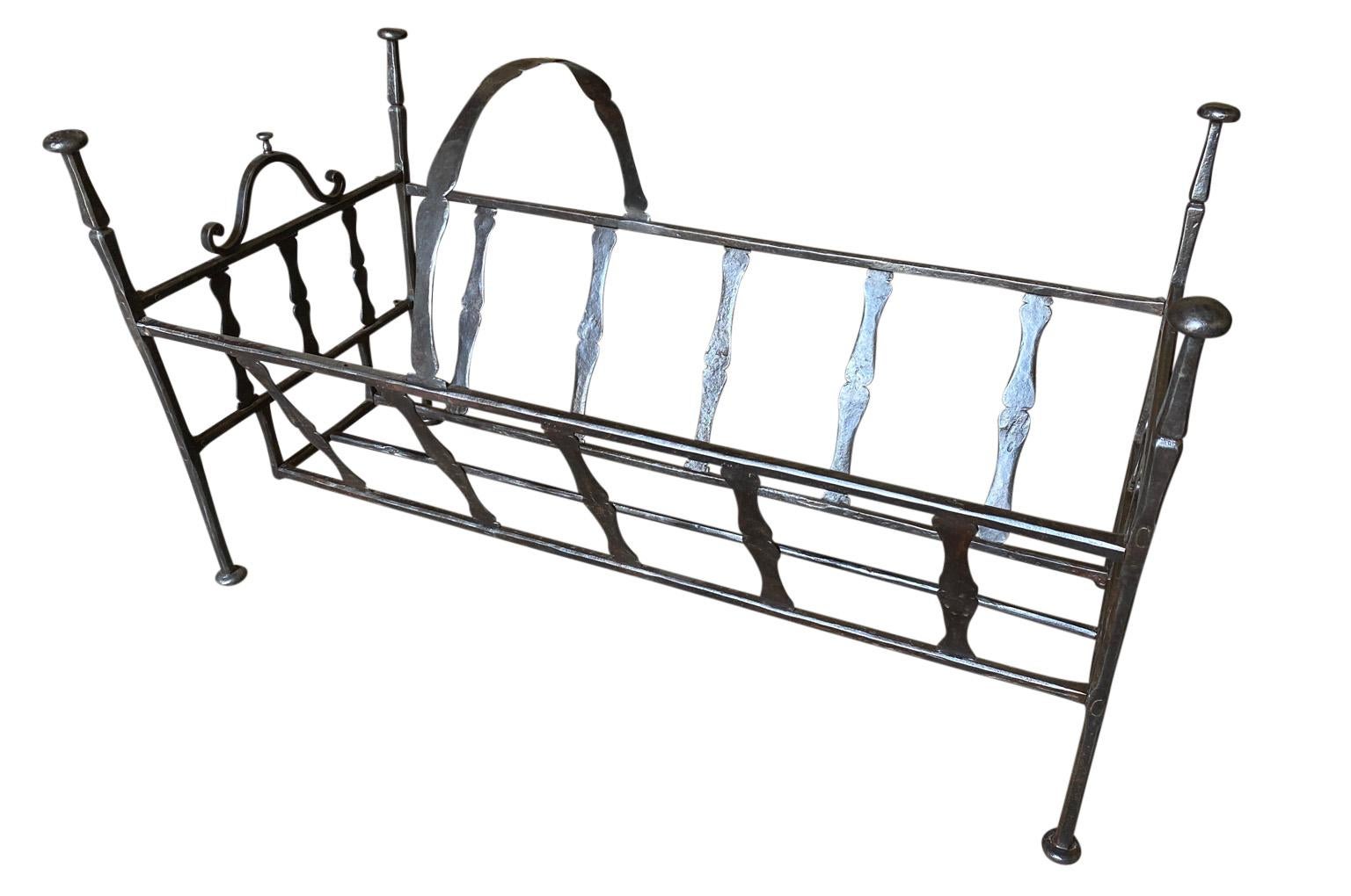A very handsome 17th century cradle - baby bed from the South of France. Wonderful constructed from forged iron. Wonderful to line the interior and use whether to store fire wood or to plant.