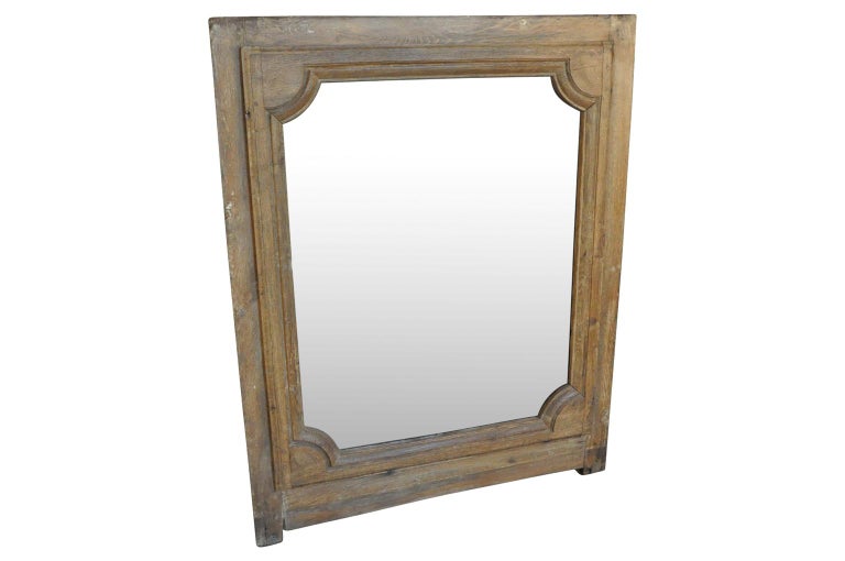 A very handsome 17th century French Louis XIV period frame now as a mirror. Beautifully carved from naturally washed oak. Wonderful patina. Perfect for over a mantel or for a bath or powder room.