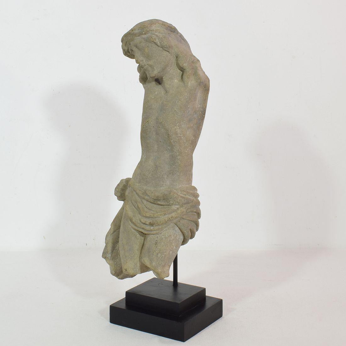 Unique carved sandstone Christ figure fragment with a strong expression. Beautiful weathered , France circa 1600-1700. Weathered, and losses. Measurement with the base.