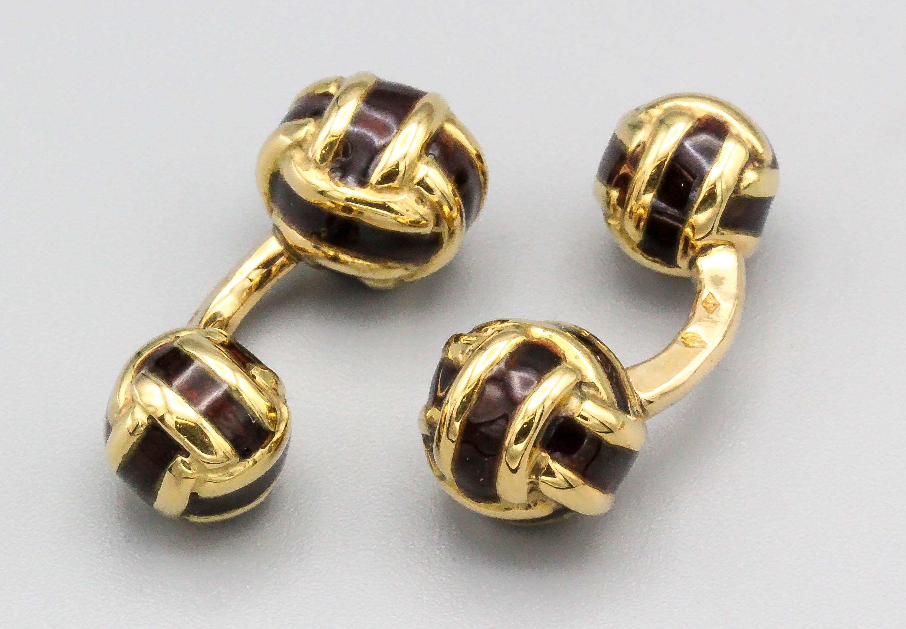 Classic and elegant 18K yellow  gold and dark brown enamel cufflink stud set of French origin. They resemble knots, with one side slightly larger than the other on the cufflinks. Includes four studs.

Hallmarks: French 18K gold assay mark, maker's