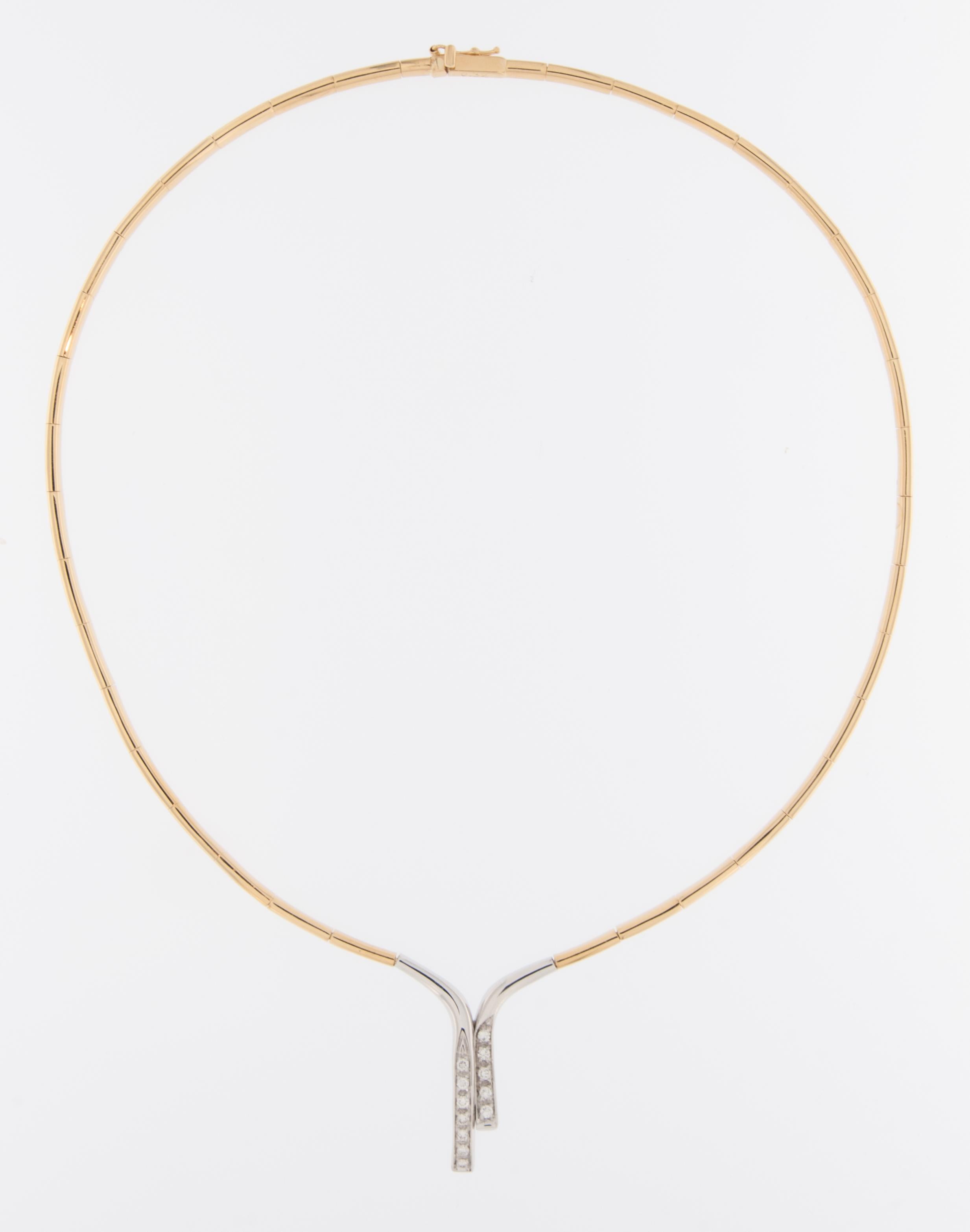 This French 18 karat gold rigid necklace is a testament to French craftsmanship and sophistication, blending the richness of yellow gold with the contemporary allure of white gold. Meticulously crafted, this necklace is an exquisite piece of jewelry
