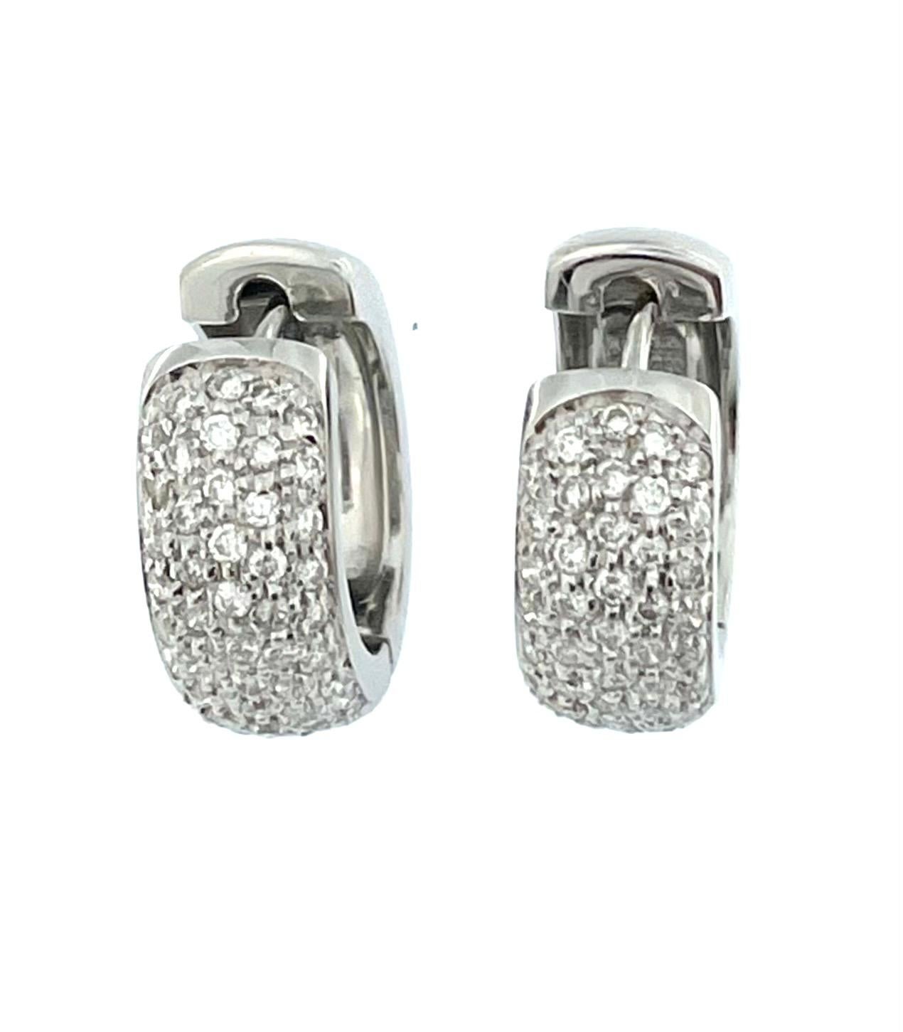 The French 18 karat White Gold Hoop Earrings with Diamonds are a classic, refined and elegant accessory. 

Crafted from 18 karat white gold, these earrings showcase a high level of purity and a luxurious, silvery-white appearance. White gold is