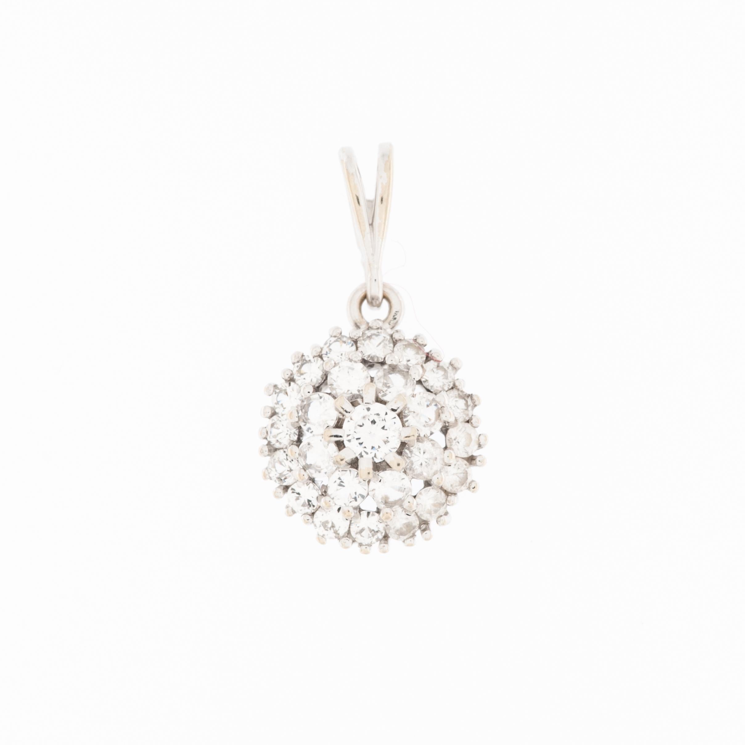 The French 18 karat White Gold Pendant with Diamonds is a sophisticated and timeless piece of jewelry that exudes elegance and refinement.

Crafted from 18 karat white gold, the pendant boasts a lustrous and modern appearance. The choice of white