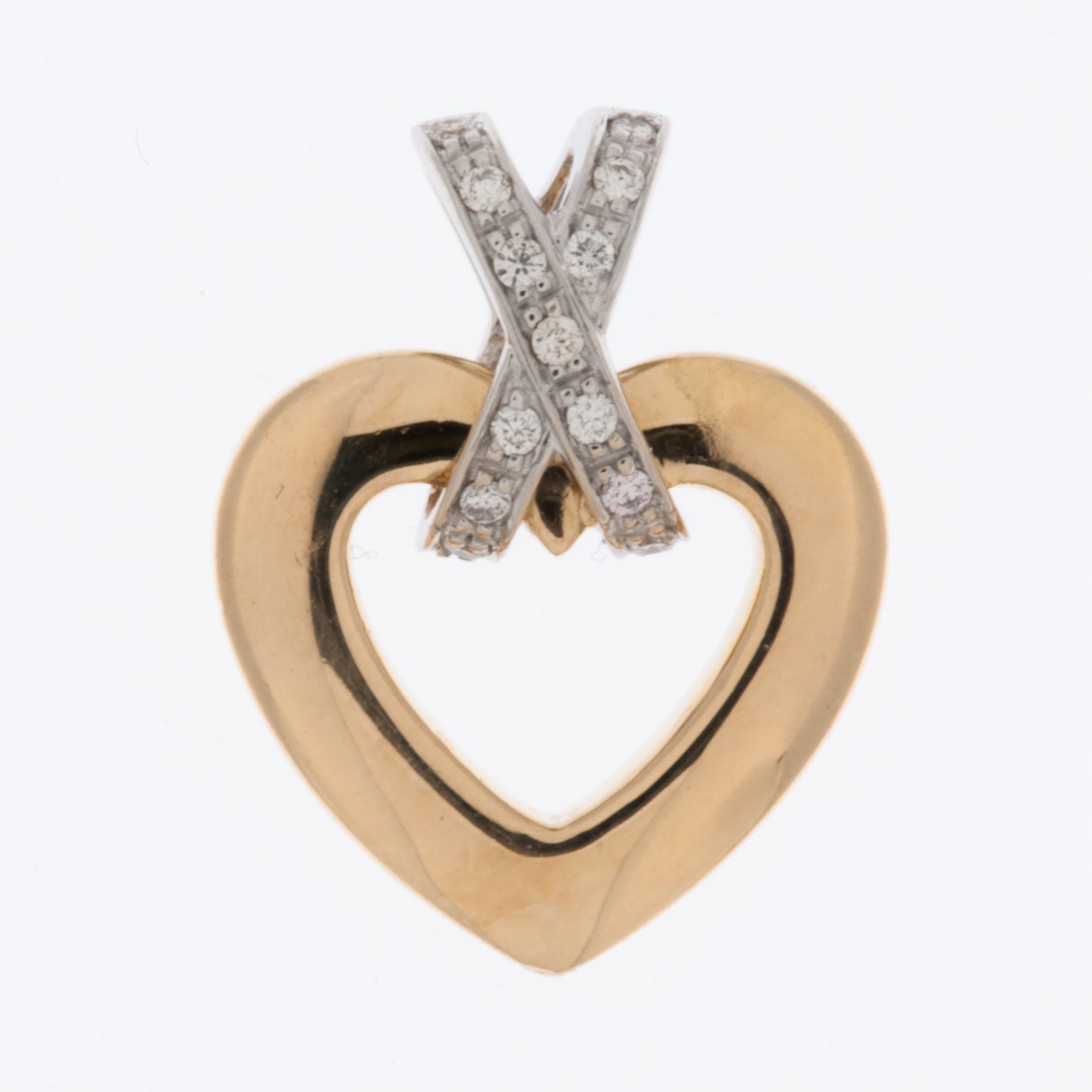 This exquisite Heart Pendant embodies the epitome of French elegance and craftsmanship. Meticulously designed, it features a harmonious blend of 18 karat yellow and white gold, showcasing the artistry and sophistication synonymous with French