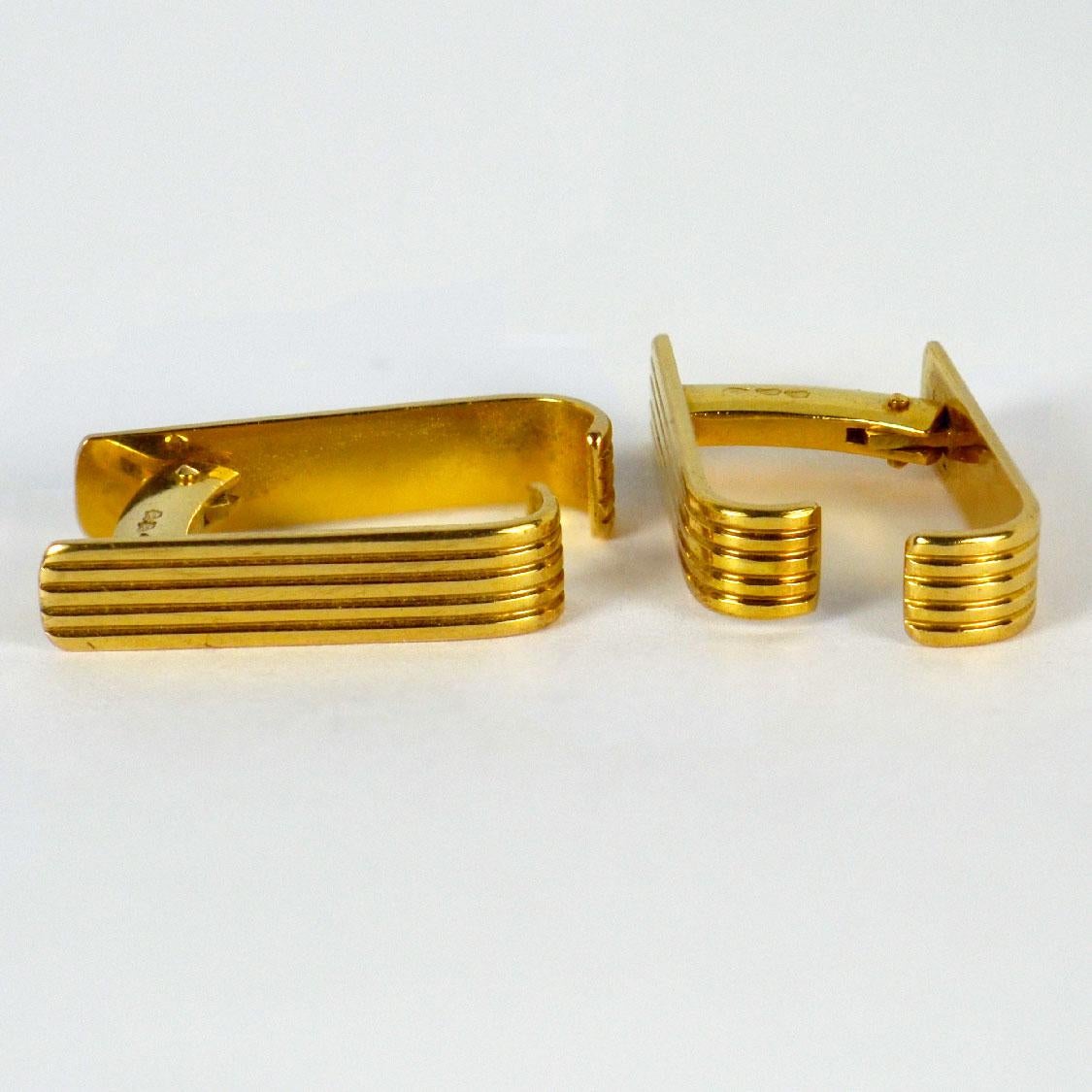 A smart pair of French 18 Karat yellow gold stirrup cufflinks with ridged detail. Stamped with the eagles head for 18 karat gold and French manufacture with an unknown makers mark.

Dimensions: 2.3 x 1.6 x 0.5 cm
Weight: 9.11 grams
