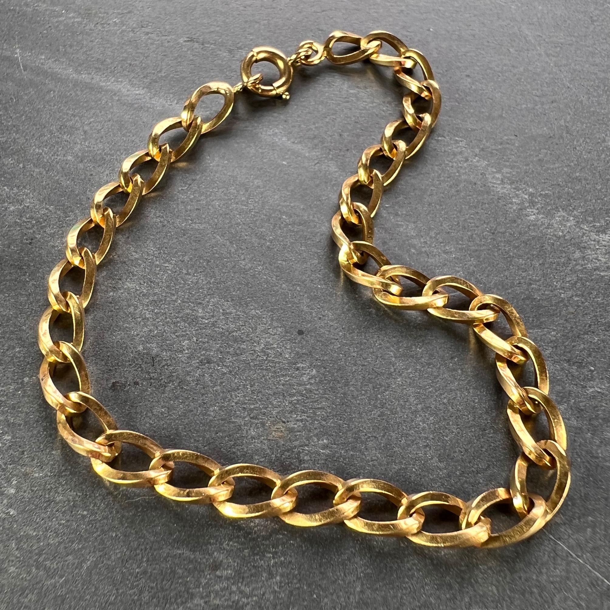 An 18 karat yellow gold curb link bracelet with squared twisted links and a spring ring clasp. Stamped with the French import mark for 18 karat gold.

Dimensions: 19 x 0.5 cm (7.5” long)
Weight: 10.22 grams
