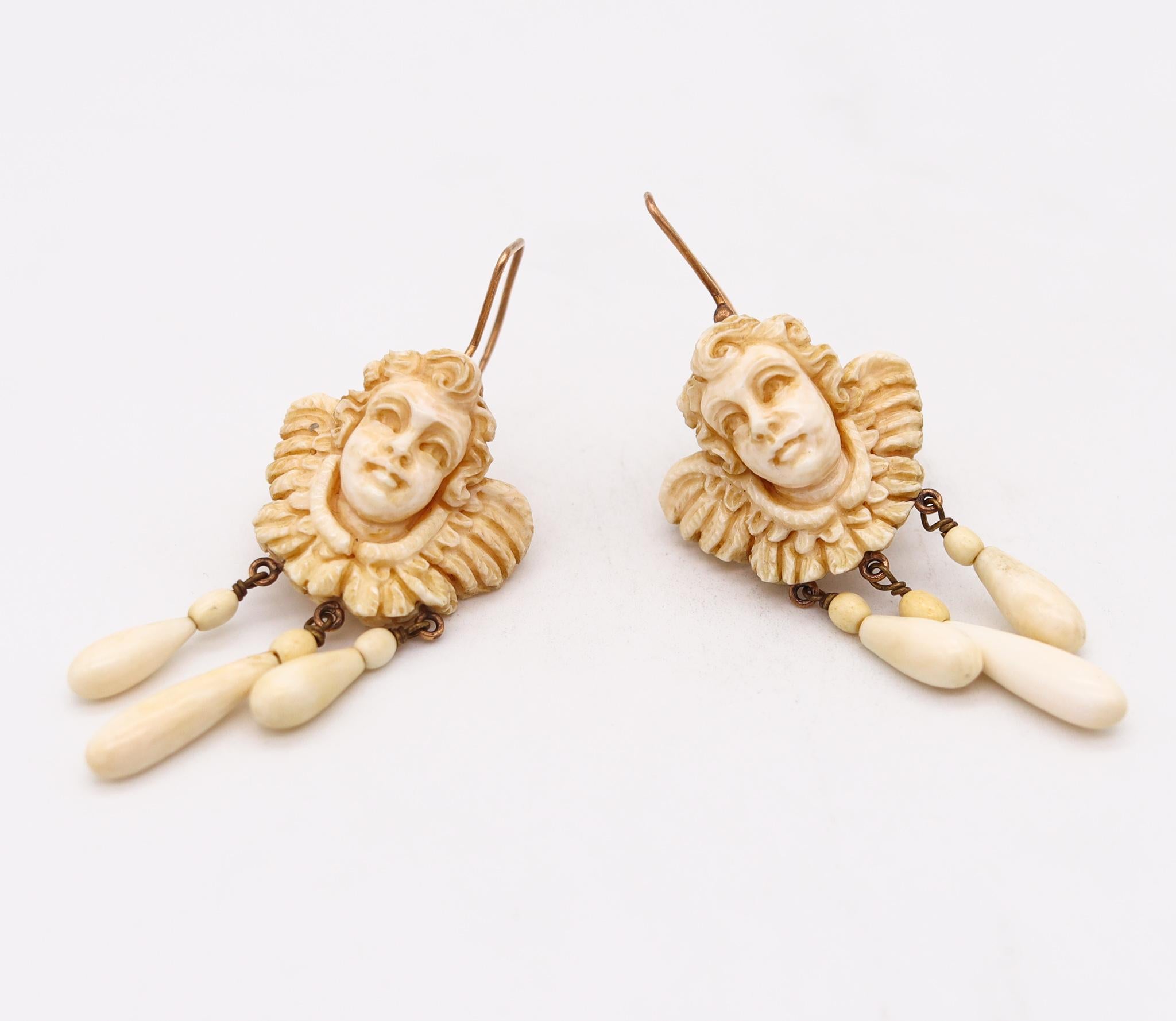 Women's French 1820 Pair of Dangle Drop Earrings in 18Kt Gold with Cherubs Carvings For Sale
