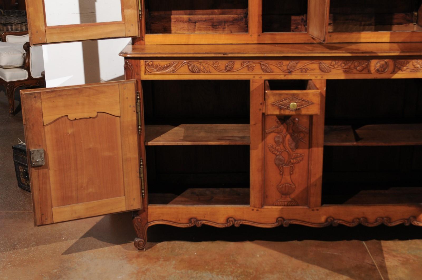 French 1820s Carved Walnut Vitrine with Glass Doors, Hidden Panels and Drawers In Good Condition For Sale In Atlanta, GA