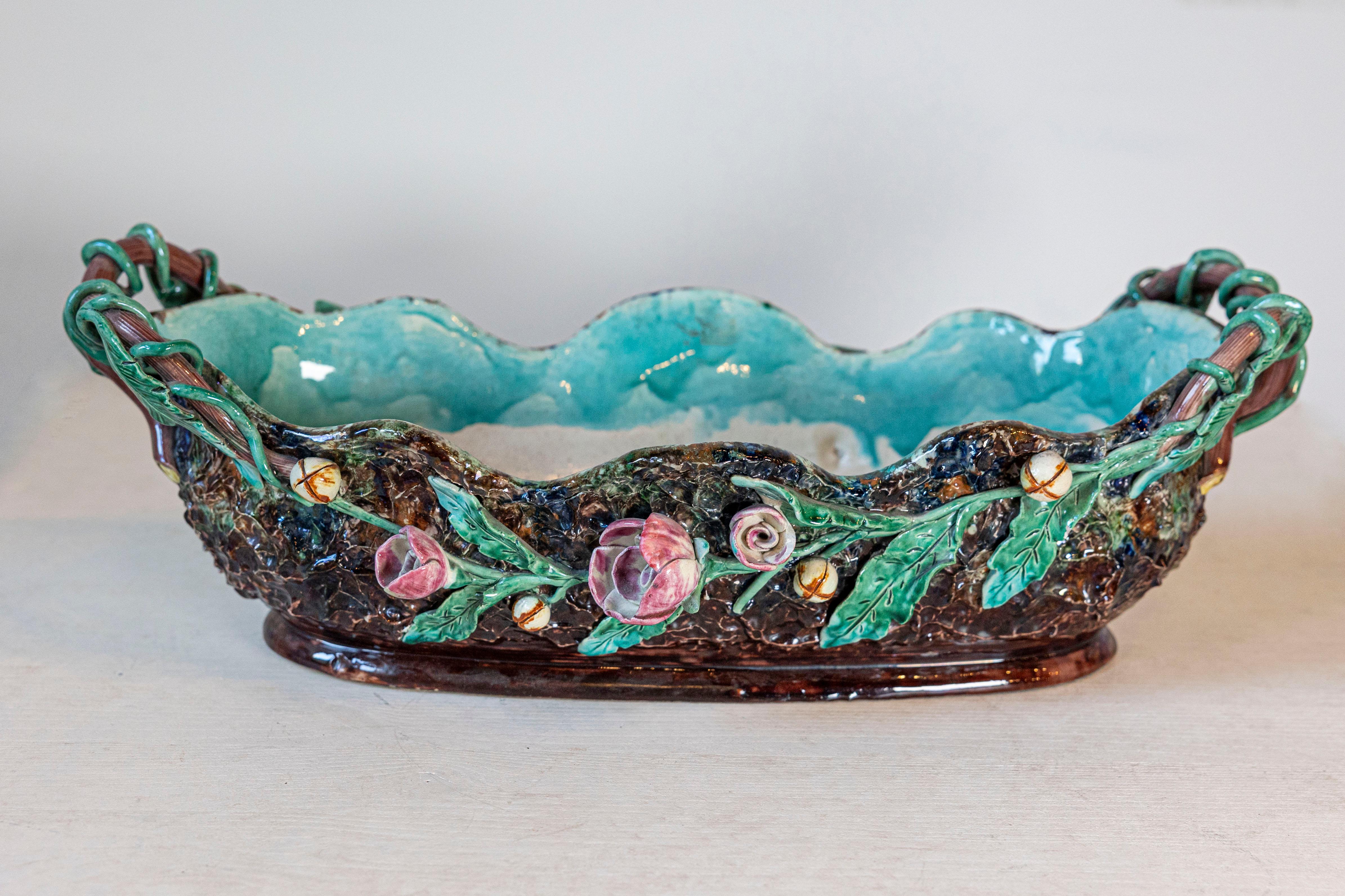 A French mid-19th century barbotine Majolica jardinière by French potter Thomas Sargent, with floral motifs. Born in France during the 19th century, this Palissy inspired Majolica jardinière features a lovely barbotine décor of delicate pastel