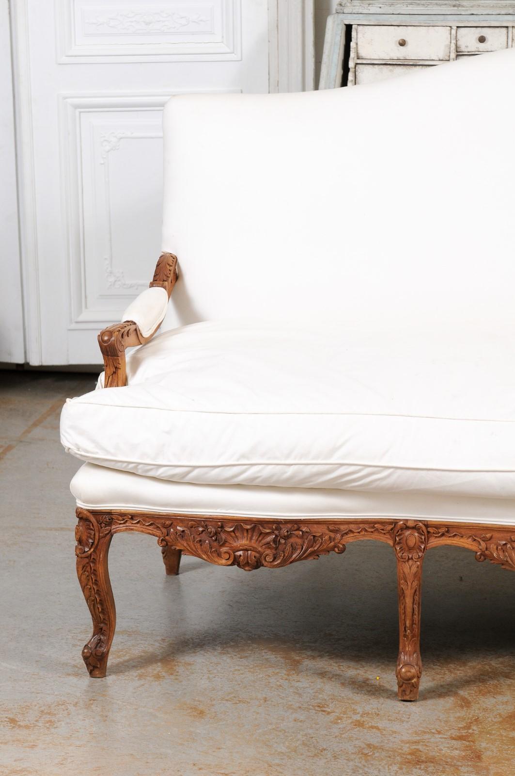19th Century French 1850s Régence Style Three-Seat Canapé with Carved Shells and Upholstery
