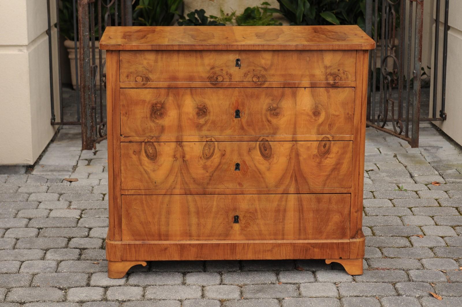 A French burled walnut commode from the late 19th century, with four graduated drawers. Born in the third quarter of the 19th century, this French four-drawer commode features a rectangular bookmark veneered top with rounded corners in the front,