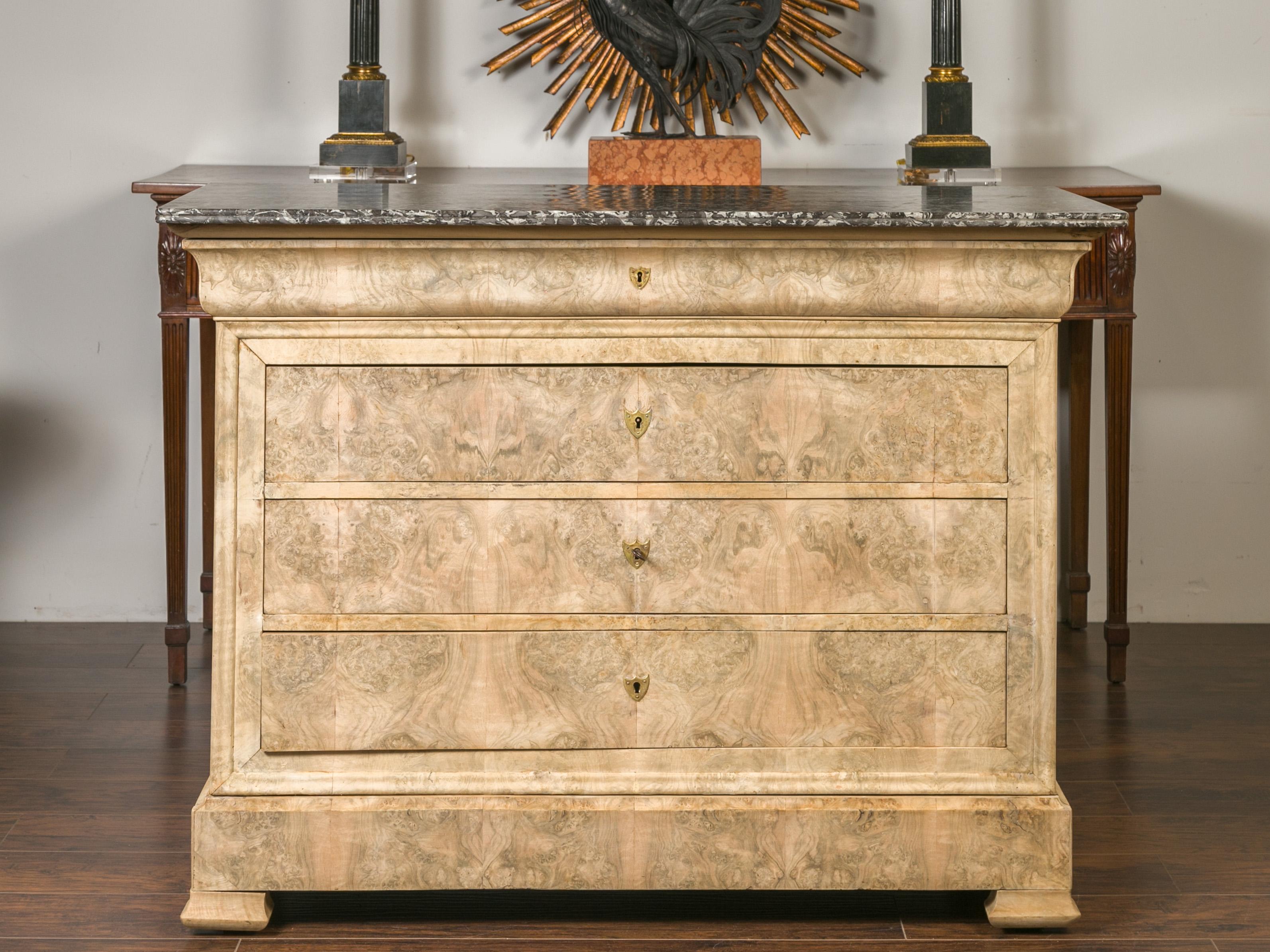 A French Louis-Philippe style bleached burl wood commode from the late 19th century, with grey marble top and five drawers. Born in France during the third quarter of the 19th century, this Louis-Philippe commode features a rectangular variegated