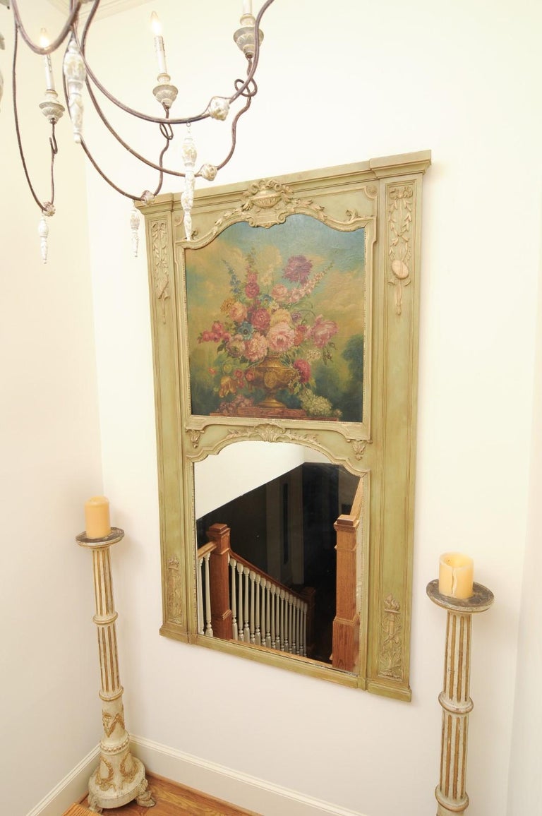 A French Napoléon III painted trumeau mirror from the late 19th century, with oil on canvas floral painting. Created in France at the end of Emperor Napoléon III's reign, this large trumeau mirror charms us with its exquisite decor and painted