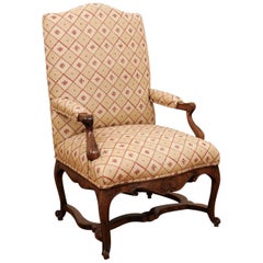 French 1870s Régence Style Walnut Armchair with Stretcher and Floral Upholstery
