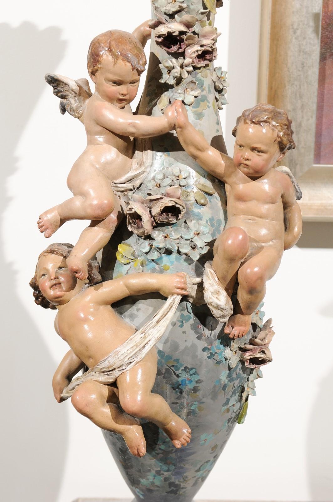 French 1870s Slender Majolica Vase with Floral Décor and High-Relief Cherubs For Sale 5