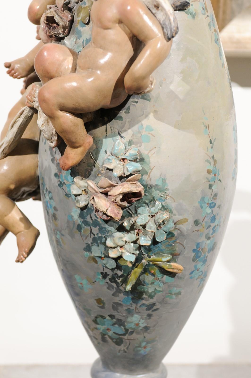 French 1870s Slender Majolica Vase with Floral Décor and High-Relief Cherubs For Sale 1