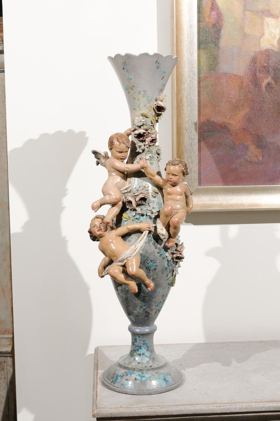 French 1870s Slender Majolica Vase with Floral Décor and High-Relief Cherubs For Sale 2